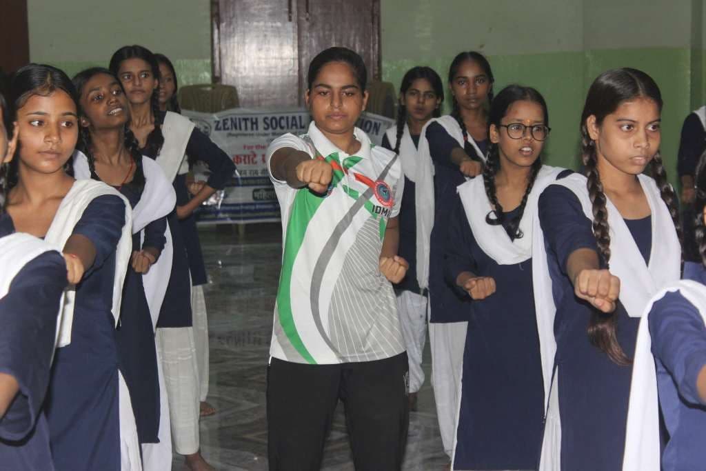 Girls in karate uniforms during training